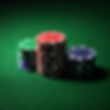 Poker chips stacked high on green felt table