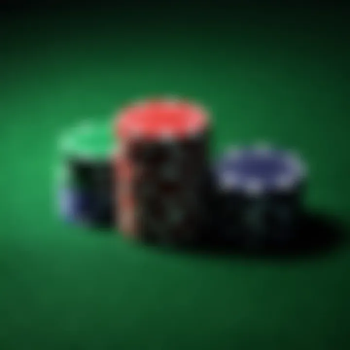 Poker chips stacked high on green felt table